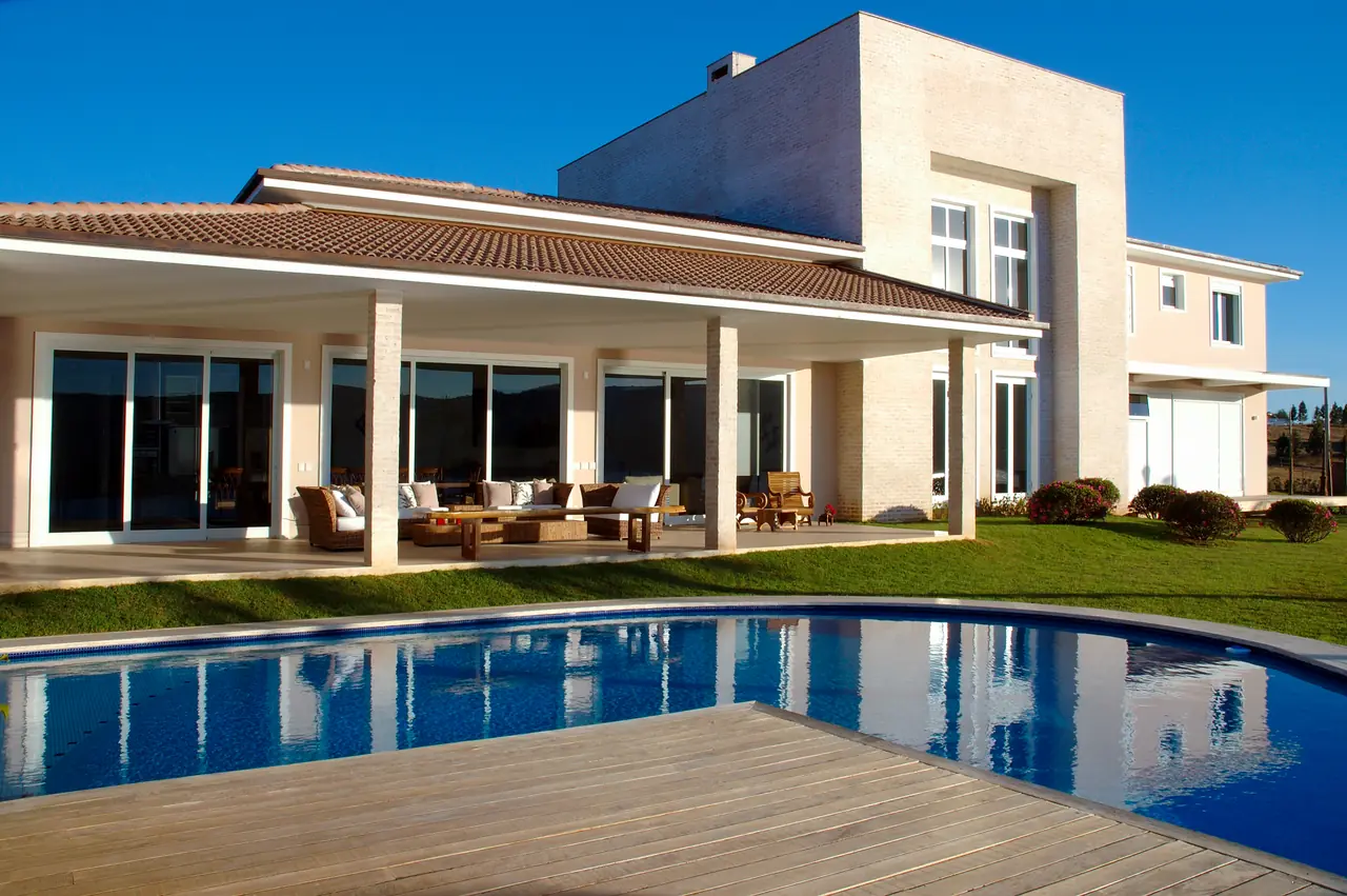 Two-storey home with a pool and timber deck